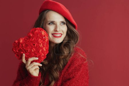 Photo for Happy Valentine. smiling trendy female in red sweater and beret with red heart. - Royalty Free Image