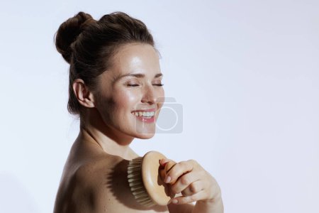 Téléchargez les photos : Happy young female with massager isolated on white. - en image libre de droit