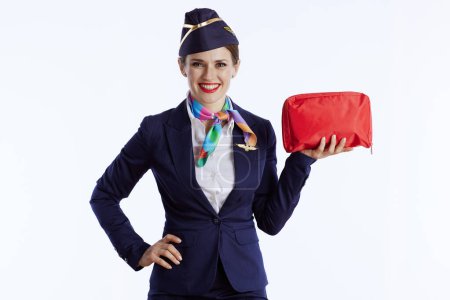 Photo for Happy elegant air hostess woman isolated on white background in uniform with first aid kit. - Royalty Free Image