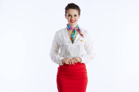 Photo for Happy elegant flight attendant woman against white background in uniform. - Royalty Free Image