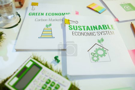 Photo for Eco aware business. calculator and documents at table. - Royalty Free Image