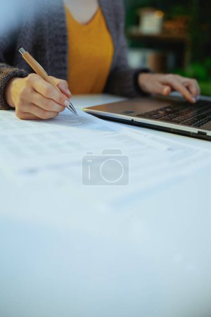 Photo for Accountant woman with documents and laptop working. - Royalty Free Image