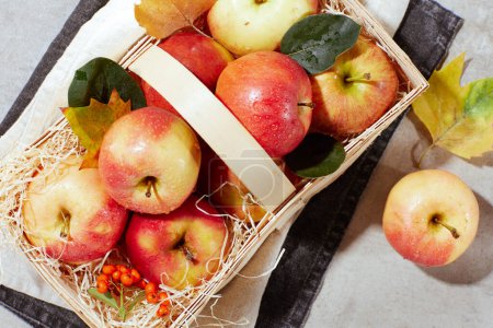 Photo for Autumn flat lay with apples, basket, autumn leaves and autumn leaf. - Royalty Free Image