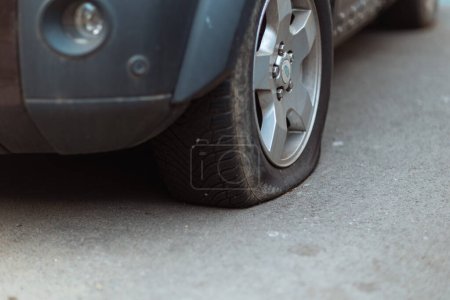 Photo for Car accident. Closeup on car with flat tire in the city. - Royalty Free Image