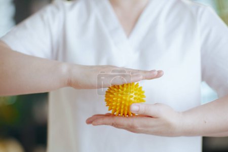 Photo for Healthcare time. Closeup on female massage therapist in spa salon with massage ball. - Royalty Free Image