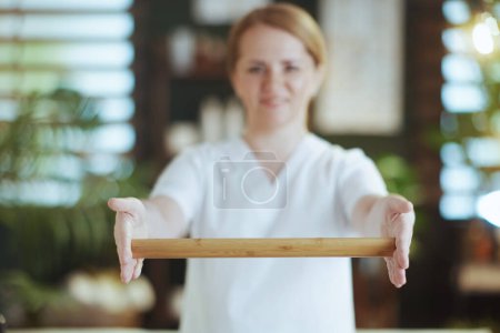 Photo for Healthcare time. Closeup on female massage therapist in spa salon with wooden massage stick. - Royalty Free Image