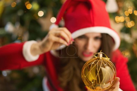 Photo for Christmas time. Closeup on woman woman witching with near Christmas tree at home. - Royalty Free Image
