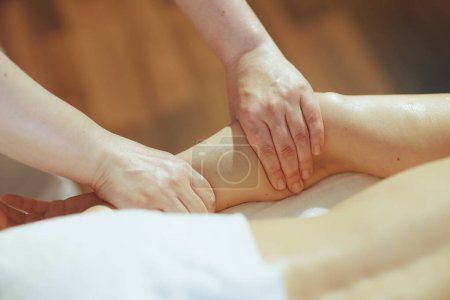 Photo for Healthcare time. Closeup on massage therapist in massage cabinet massaging clients arm. - Royalty Free Image