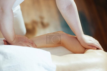 Photo for Healthcare time. Closeup on massage therapist in massage cabinet massaging clients arm. - Royalty Free Image