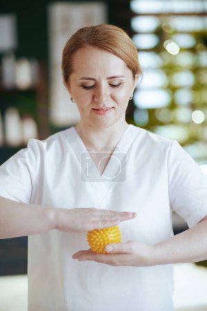 Photo for Healthcare time. massage therapist woman in spa salon with massage ball. - Royalty Free Image