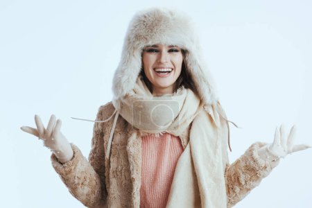 Photo for Happy stylish woman in winter coat and fur hat isolated on white background in white gloves having fun time. - Royalty Free Image