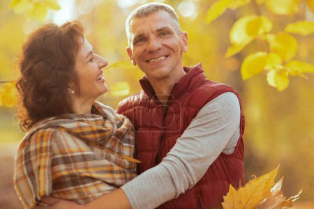 Photo for Hello autumn. smiling stylish couple in the park hugging. - Royalty Free Image