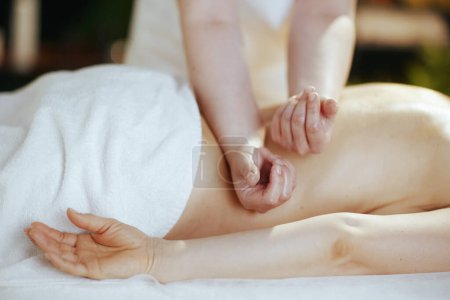 Photo for Healthcare time. massage therapist in spa salon massaging client. - Royalty Free Image