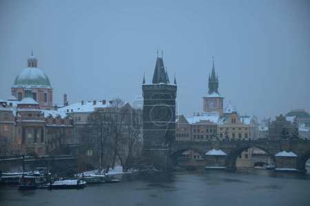 Photo for Landscape in winter in Prague, Czech Republic with Vltava river and Charles Bridge in the evening. - Royalty Free Image