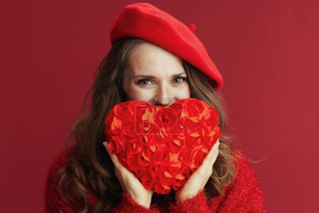 Foto de Happy Valentine. happy modern woman in red sweater and beret with red heart. - Imagen libre de derechos