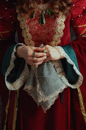 Photo for Closeup on medieval queen in red dress with handkerchief. - Royalty Free Image