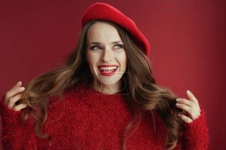 Photo for Happy Valentine. happy stylish middle aged woman with long wavy hair in red sweater and beret. - Royalty Free Image