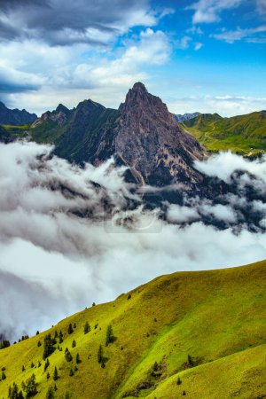 Photo for Summer time in Dolomites. landscape with mountains, hills, clouds and trees. - Royalty Free Image
