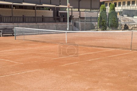 Photo for Red clay court surface closeup in tennis complex - Royalty Free Image