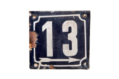 Weathered grunge square metal enameled plate of number of street address with number 13 isolated on white background
