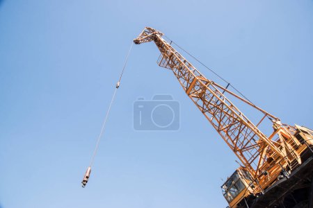 Detail of port industrial crane closeup on clear sunny day