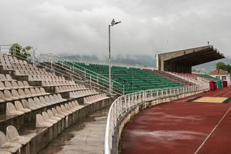 Photo for Stadium bleachers in stadium on cloudy day - Royalty Free Image