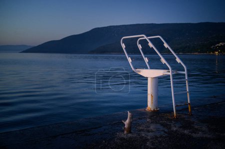 Photo for White ladder of a diving board at the beach in Cres (Croatia) - Royalty Free Image