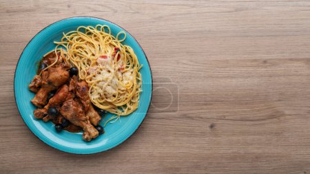 Photo for Chicken cacciatore with black olives, pepperoni, tomatoes, with italian spaghetti pasta. Italian food - Royalty Free Image