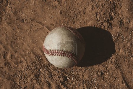 Photo for Baseball ball concept in field dirt - Royalty Free Image