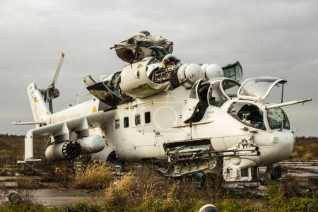 Photo for Destroyed combat helicopteres at the International Airport of Kherson, located in Kherson Oblast in Ukraine. The Chernobaivka attacks are a series of Ukrainian attacks on the Russian-held Kherson International Airport during the Russian invasion camp - Royalty Free Image