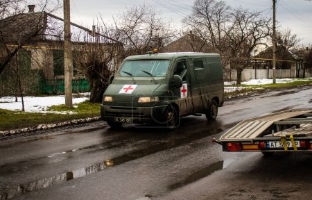 Photo for Military ambulance which is used by the medical team of the Carpathian Sich Battalion to evacuate wounded or killed Ukrainian soldiers from the front line on the battlefields in the Donbas - Royalty Free Image
