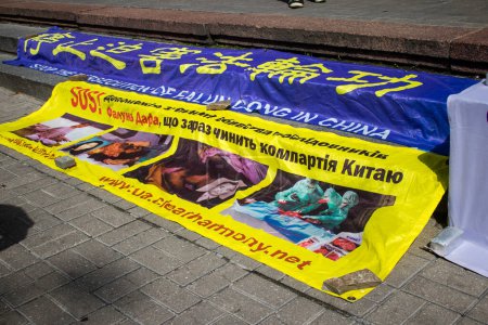 Photo for Anti-Chinese demonstration and against communist policy in the center of Kyiv. The objective of this demonstration is to inform people about the thefts of organs committed on prisoners by the Chinese government. - Royalty Free Image