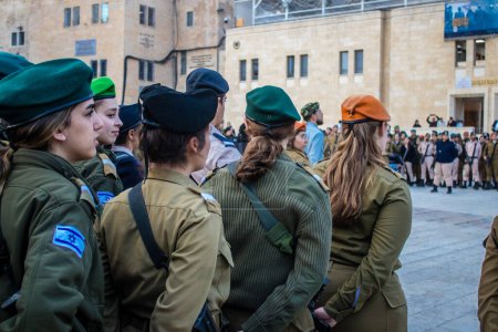 Photo for Jerusalem, Israel December 27, 2023 Induction ceremony for new graduates of the IDF Officers School. The soldiers come from different battalions and after two months of training they are appointed officers. - Royalty Free Image