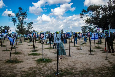 Photo for Re'im, Israel  January 5, 2024 Memorial composed of photos of young Israelis killed during the terrorist attack against the NOVA Festival which took place on October 7, 2023 a few kilometers from Gaza in the south of Israel near the Kibbutz of Reim - Royalty Free Image