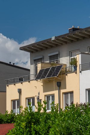 Photo for Balcony solar power station eco-friendly to use renewable energy. Solar power plant on a balcony to generate green electrical energy for home. - Royalty Free Image