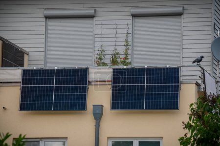 Photo for Balcony solar power station eco-friendly to use renewable energy. Solar power plant on a balcony to generate green electrical energy for home. - Royalty Free Image