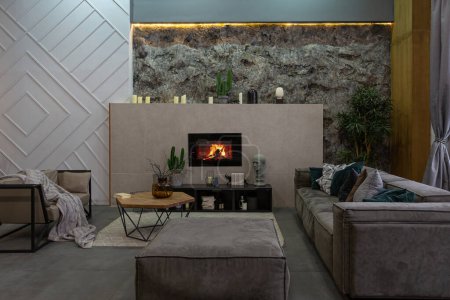modern studio interior with decorative stone walls in grey. stone wood, tiles and led lighting in the design of the room.