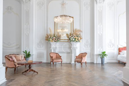 Photo for Royal baroque style luxury posh interior of large room. extra white, full of day light. high ceiling and walls decorated by stucco - Royalty Free Image