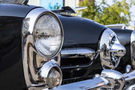 Close up detail of a shiny old classic car in natural light.