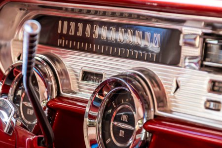 Photo for The interior of a 1957 Pontiac Star Chief in red and white color scheme. - Royalty Free Image