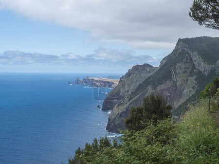 Views from Vereda do Larano coastal hiking trail. Cliffs atlantic ocean and green tropical vegetation. Madeira island, Portugal, Europe