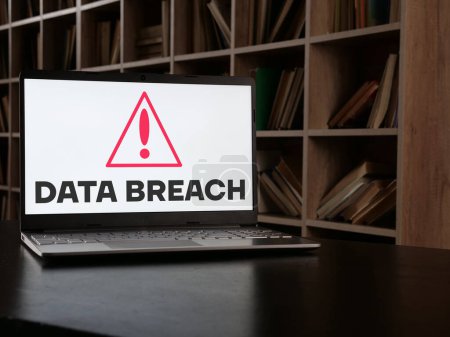 Photo for Data breach is shown using a text and picture of sign of alarm - Royalty Free Image