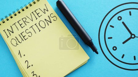 Photo for Interview Questions are shown using a text and photo of the notepad - Royalty Free Image