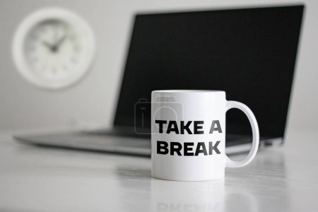 Take a break is shown using a text on the cup and photo of the clock