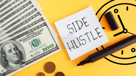 Photo for Side Hustle is shown using a text and photo of dollars and the clock - Royalty Free Image