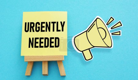 Photo for Urgently Needed is shown using a text - Royalty Free Image