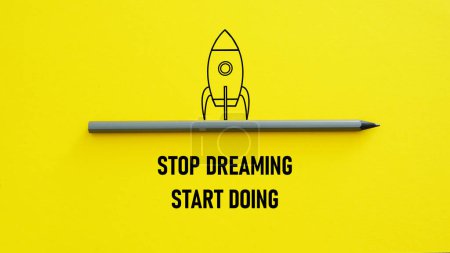 Photo for Stop dreaming start doing is shown using a text and picture of the rocket - Royalty Free Image