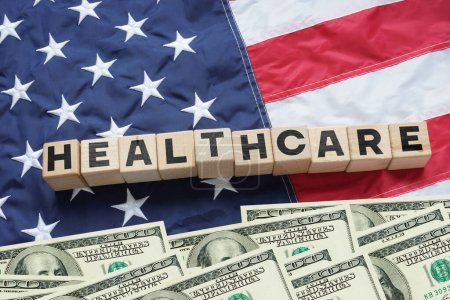 Photo for Healthcare reform in USA. Word Healthcare on American Flag. Social and political issue of healthcare and medicine changes in USA - Royalty Free Image