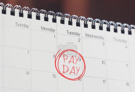Le jour de paie est affiché en utilisant un texte sur le calendrier. Prêt sur salaire ou avance sur salaire
