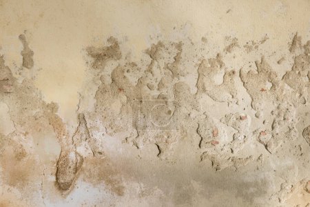Photo for Textured background of an old yellow beige plaster wall - Royalty Free Image